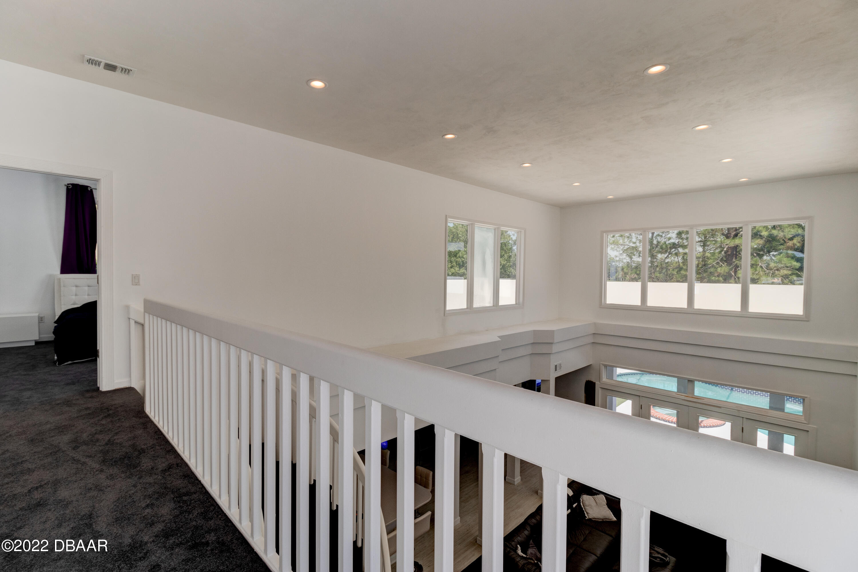 13 Bay Pointe Drive Ormond Beach, FL 32174 - Photo 27 of 44 a view of an entryway wooden floor and windows
