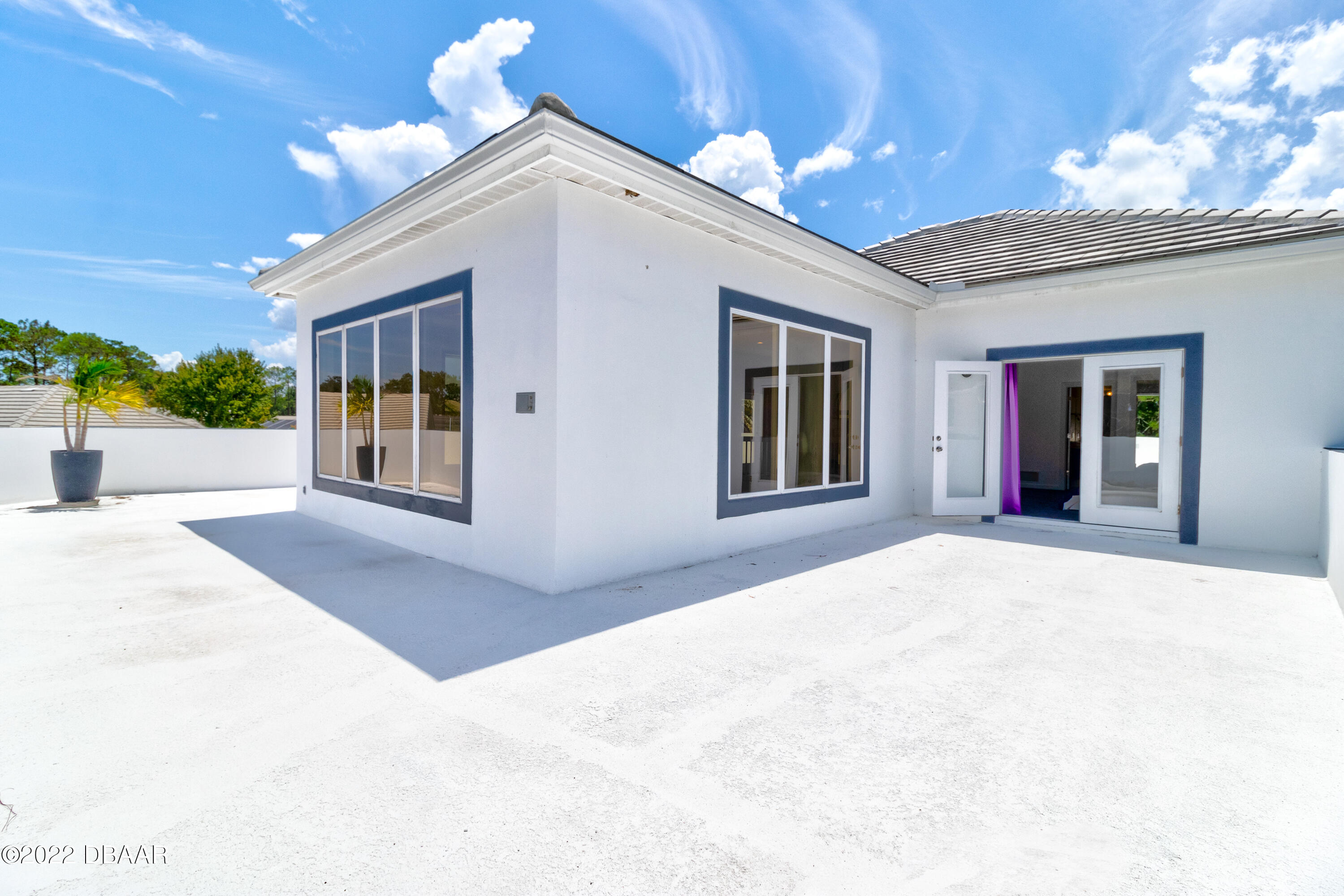 13 Bay Pointe Drive Ormond Beach, FL 32174 - Photo 30 of 44 a front view of a house with a yard