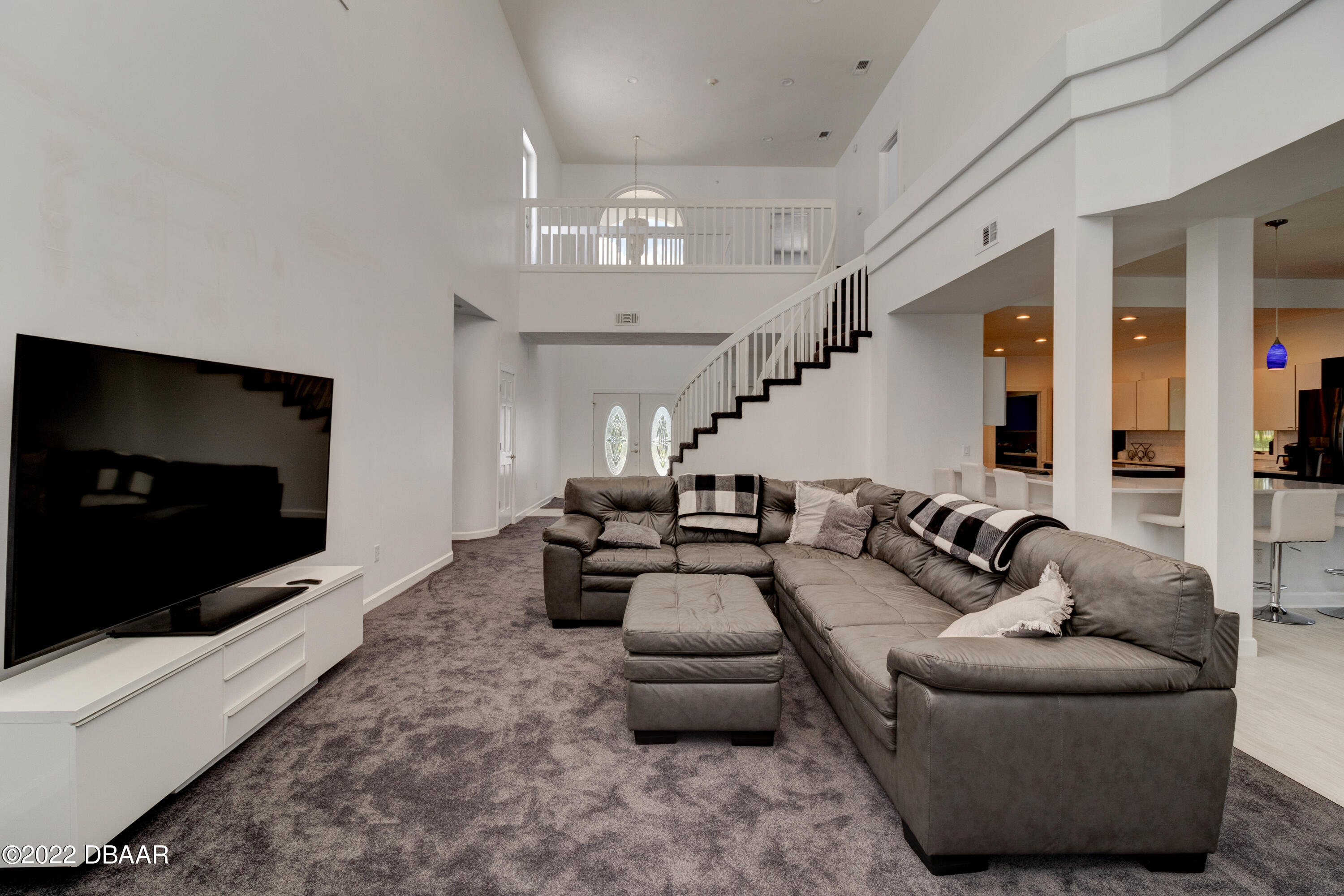 13 Bay Pointe Drive Ormond Beach, FL 32174 - Photo 4 of 44 a living room with furniture and a flat screen tv