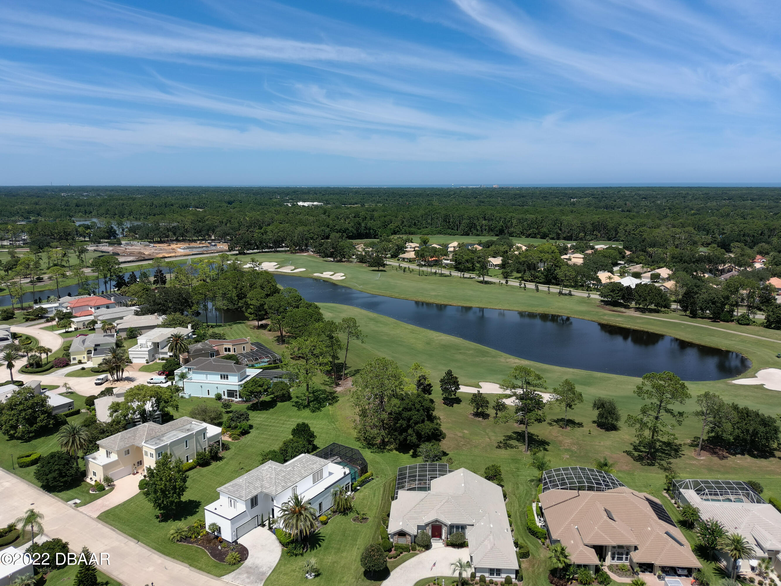 13 Bay Pointe Drive Ormond Beach, FL 32174 - Photo 44 of 44 an aerial view of a city with lots of residential buildings ocean and mountain view in back