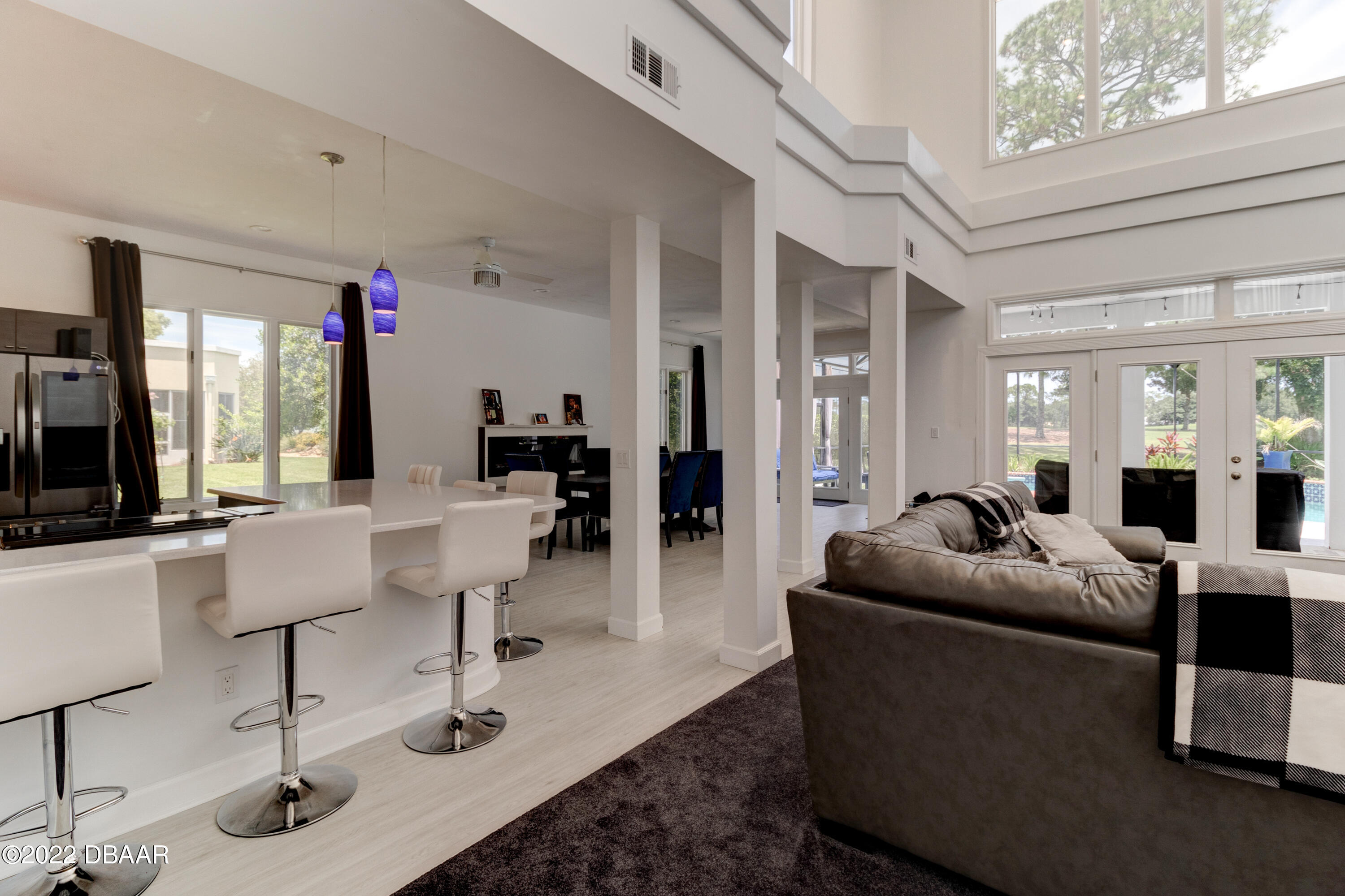 13 Bay Pointe Drive Ormond Beach, FL 32174 - Photo 5 of 44 a living room with furniture and a chandelier