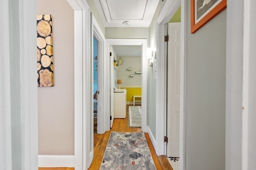 100 Winifred Avenue Worcester, MA 01602 - Photo 14 of 34 a view of a hallway with wooden floor and a dining room