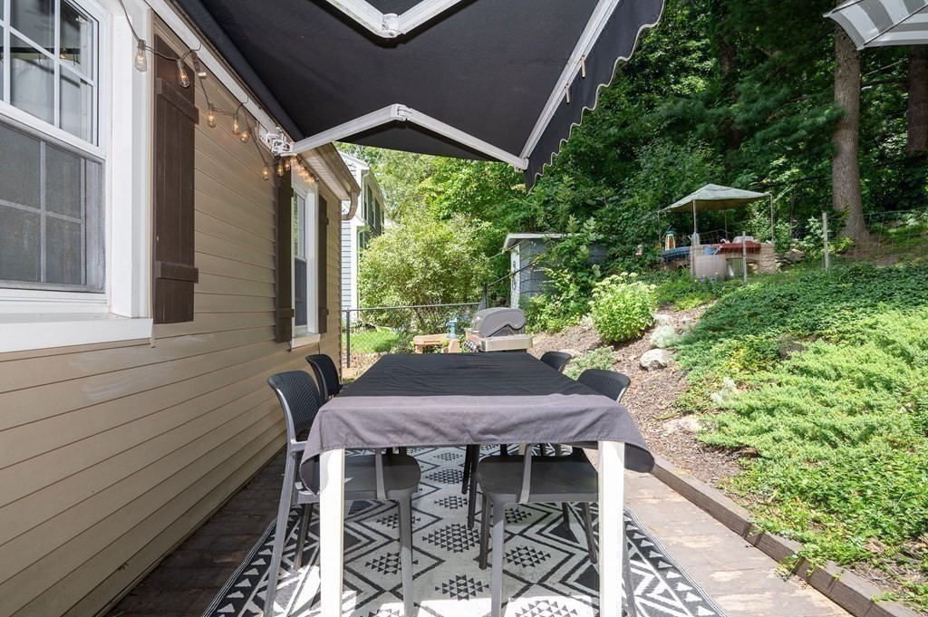 100 Winifred Avenue Worcester, MA 01602 - Photo 22 of 34 a view of a patio with table and chairs with wooden floor and fence