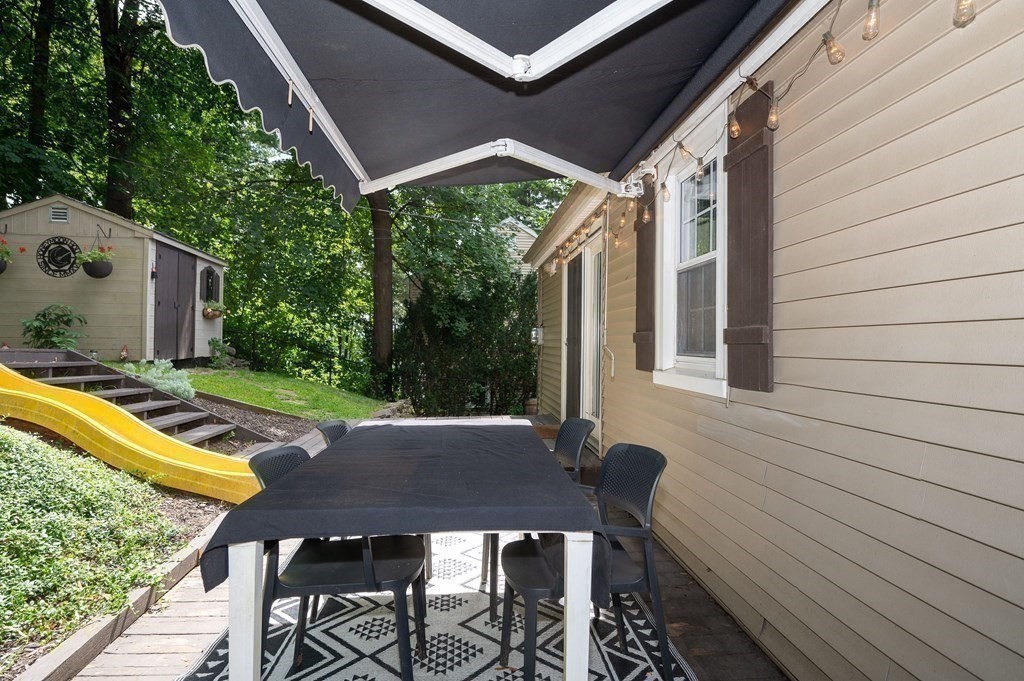 100 Winifred Avenue Worcester, MA 01602 - Photo 28 of 34 a view of patio with a table and chairs under an umbrella