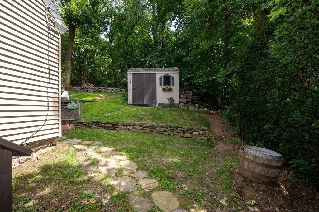 100 Winifred Avenue Worcester, MA 01602 - Photo 29 of 34 a backyard of a house with yard and outdoor seating