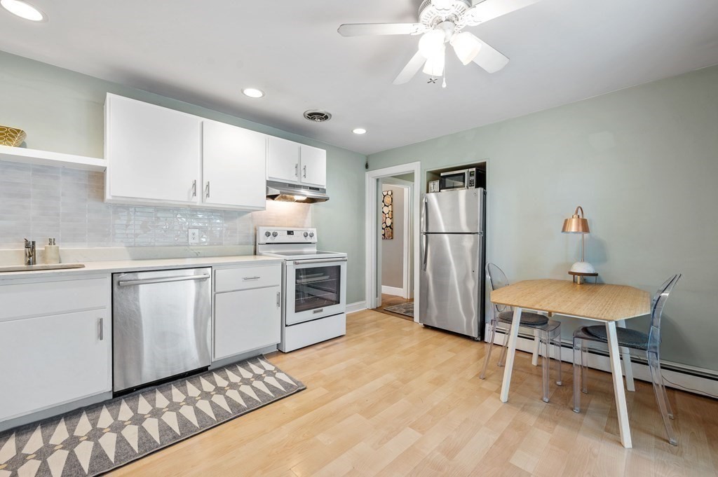 100 Winifred Avenue Worcester, MA 01602 - Photo 3 of 34 a kitchen with stainless steel appliances granite countertop a stove refrigerator sink and cabinets