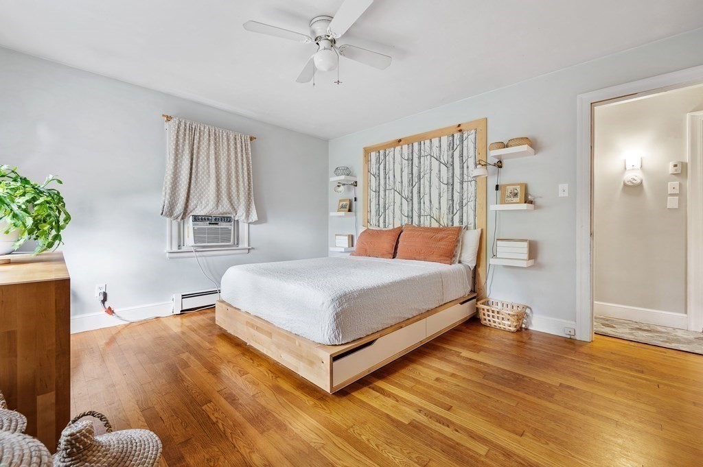 100 Winifred Avenue Worcester, MA 01602 - Photo 8 of 34 a bedroom with a bed and wooden floor
