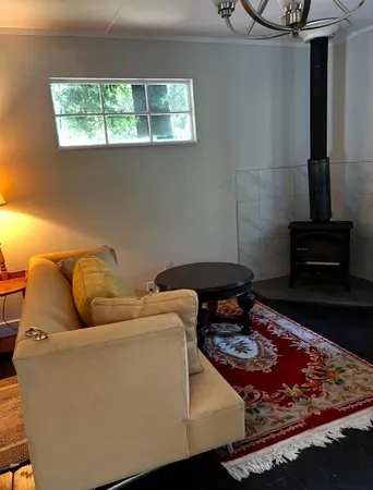 a living room with a couch and a stove