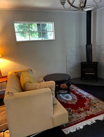 a living room with a couch and a stove