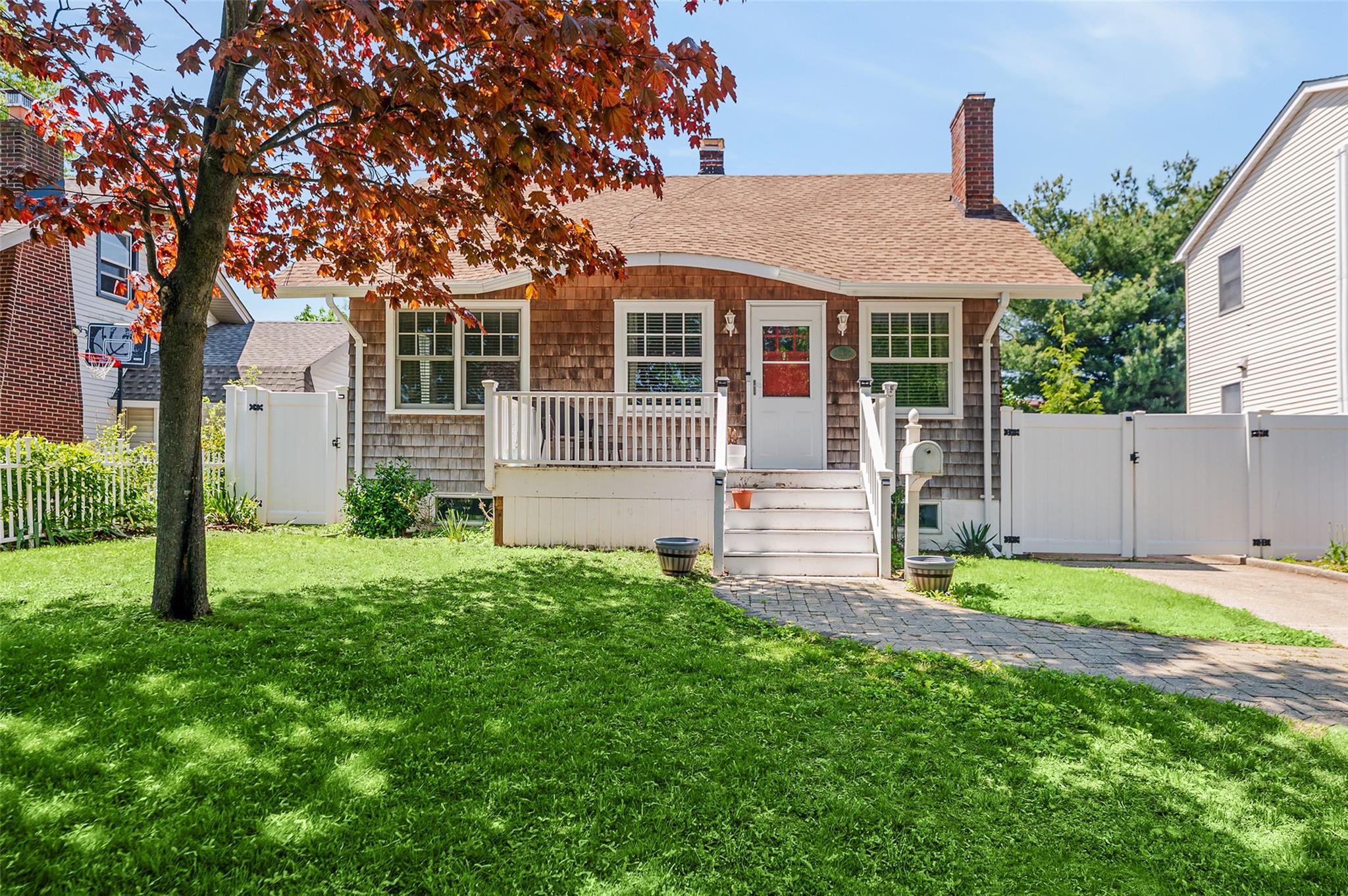 front view of a house with a yard