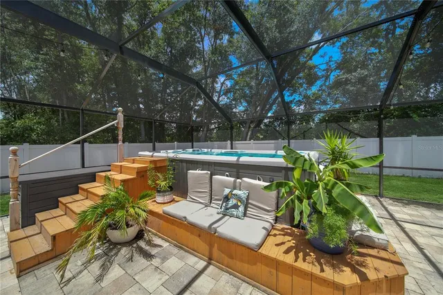 a view of a swimming pool with a patio