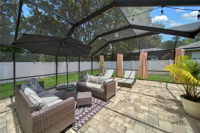 a patio with a patio table and chairs