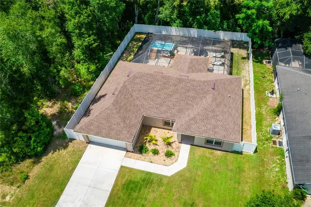 a view of a house with a yard and sitting area