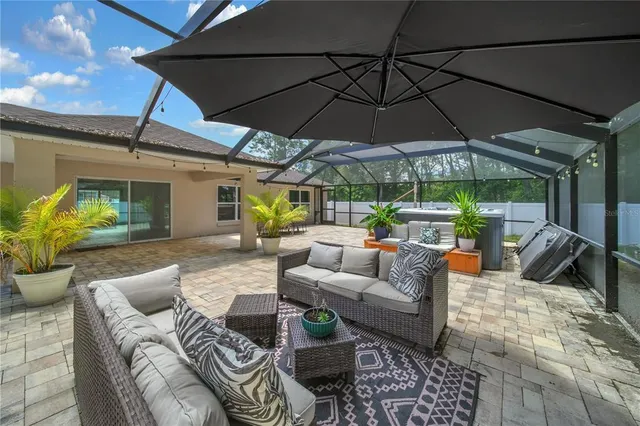 a outdoor space with patio the couches and a umbrella