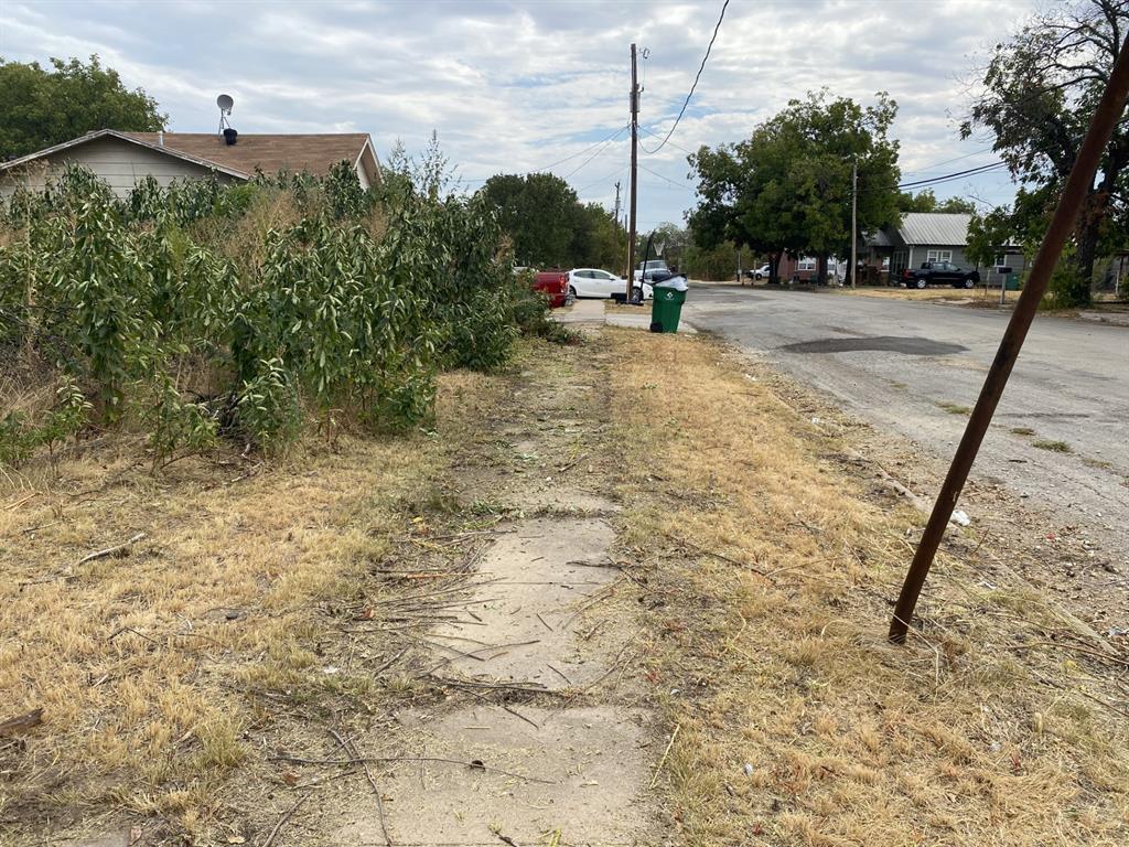 217 West 3rd Street Coleman, TX 76834 - Photo 3 of 3 a view of a yard with a slide
