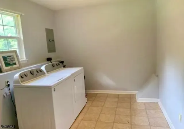 a utility room with a sink washer and dryer