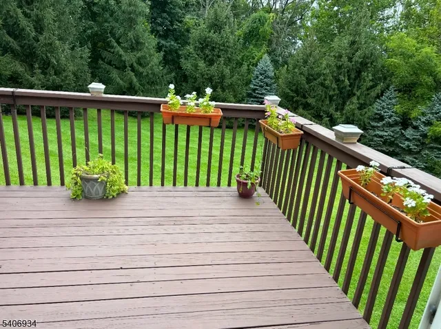 a balcony with trees in front of it
