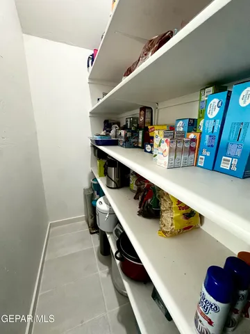 a dining room with furniture and a chandelier