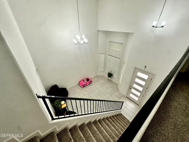 a bedroom with a bed and a television