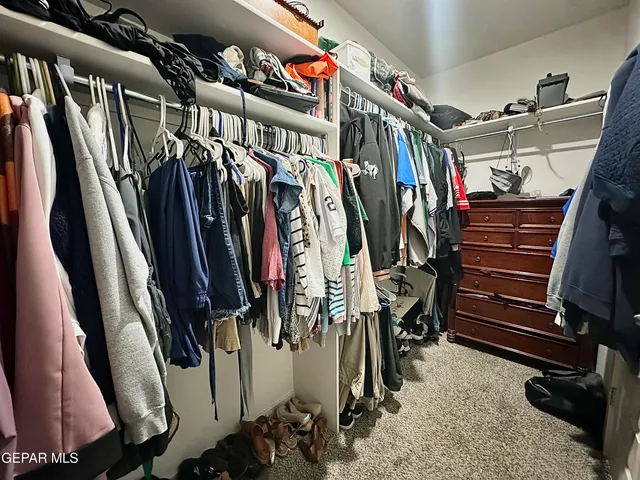 a room with a couch and a chandelier