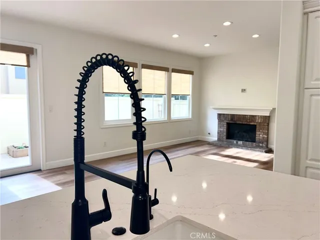 a view of entryway with a front door and wooden floor