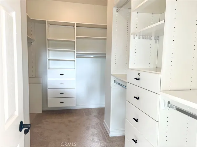 a view of closet and cabinet