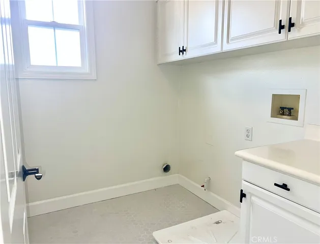 a bathroom with a sink and cabinets