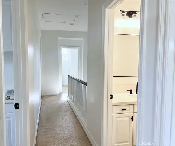 a bedroom with a bed and cabinets