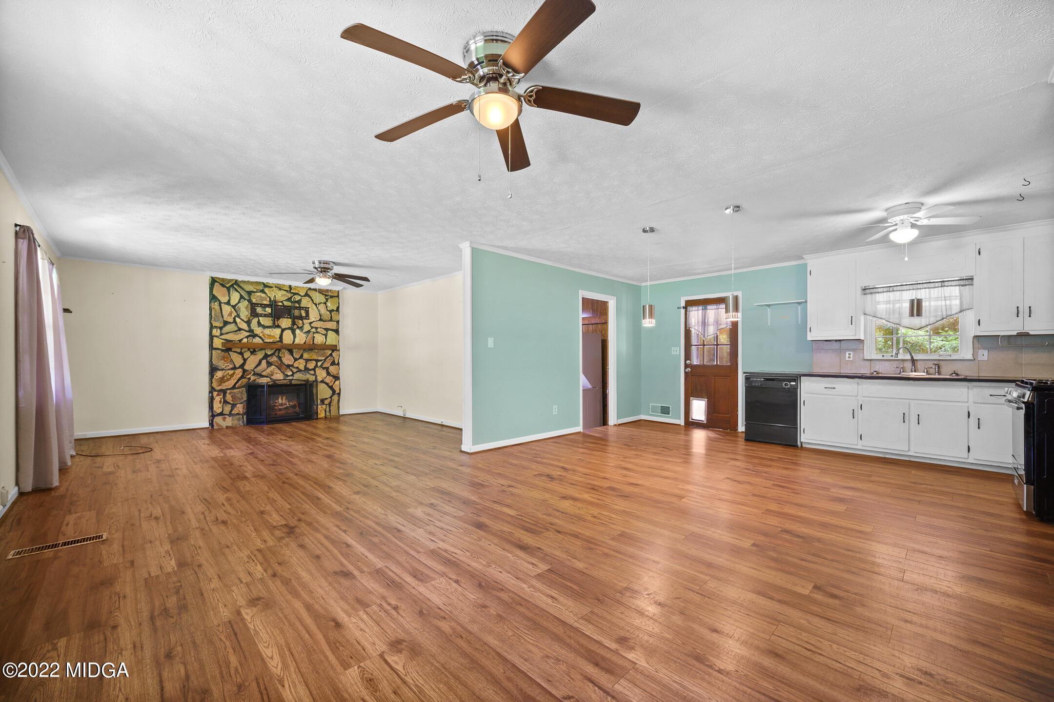 194 Short Street Jackson, GA 30233 - Photo 4 of 31 a view of an empty room with window and wooden floor