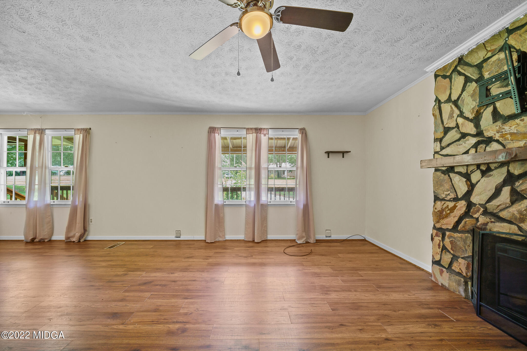 194 Short Street Jackson, GA 30233 - Photo 7 of 31 a view of an empty room and window with wooden floor