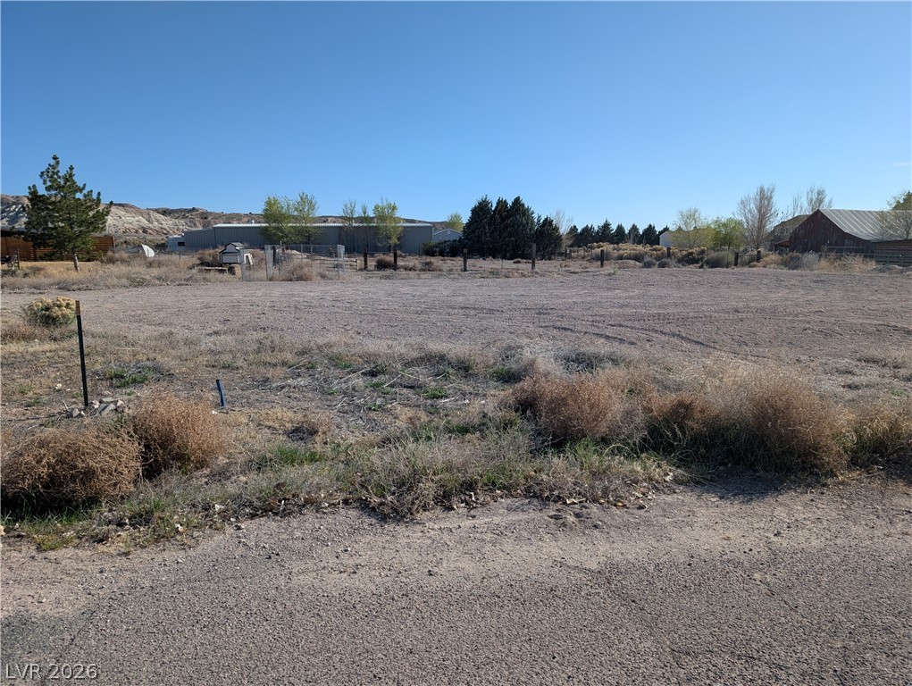 Deck Street Panaca, NV 89042 - Photo 11 of 12 View of yard featuring a view of rural / pastoral area