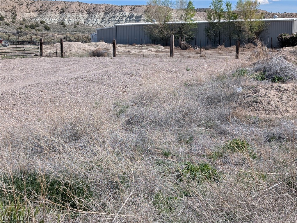 Deck Street Panaca, NV 89042 - Photo 2 of 12 View of yard featuring a mountain view