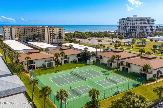 a view of a balcony with an outdoor seating