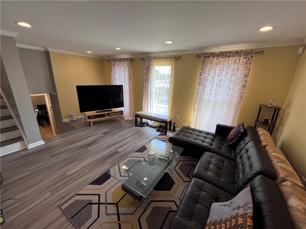 1875 Linton Street Pittsburgh, PA 15219 - Photo 11 of 24 a living room with furniture and a flat screen tv