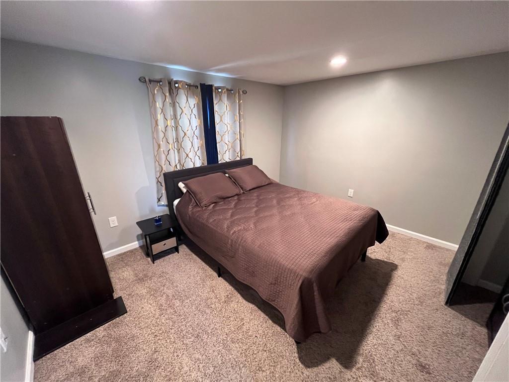 1875 Linton Street Pittsburgh, PA 15219 - Photo 17 of 24 a bedroom with a bed and a window