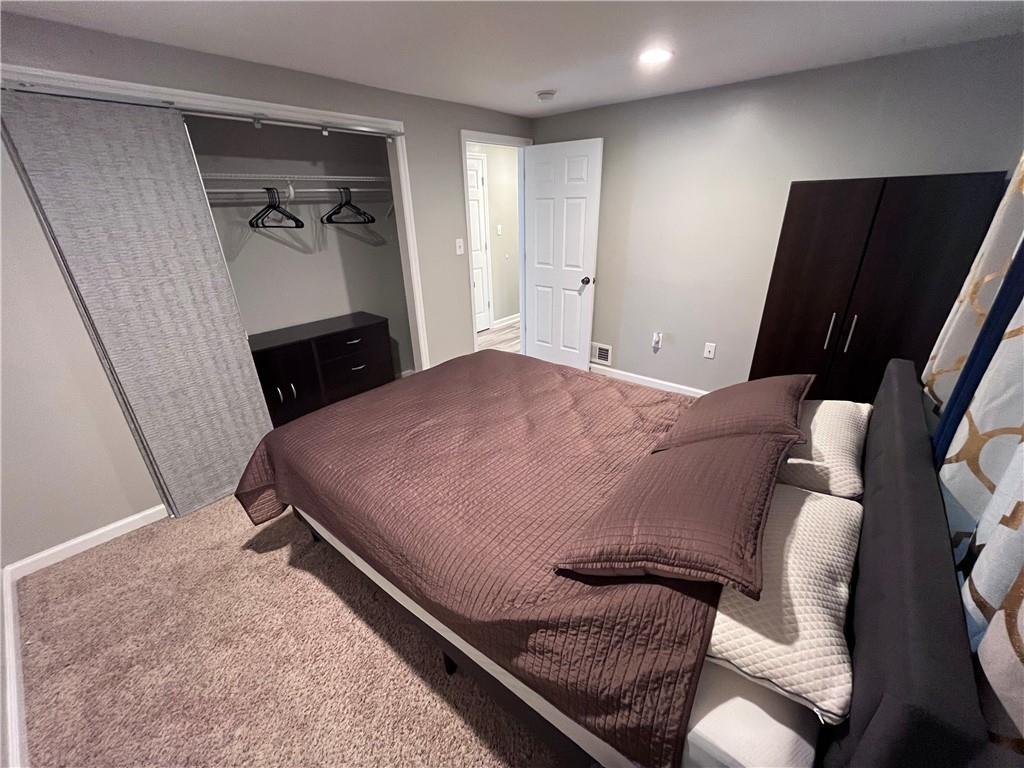 1875 Linton Street Pittsburgh, PA 15219 - Photo 18 of 24 a bed room with a bed and a television