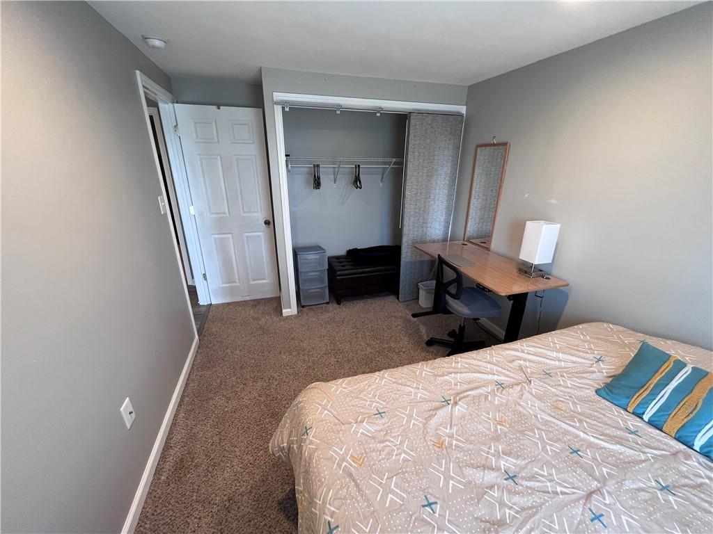 1875 Linton Street Pittsburgh, PA 15219 - Photo 20 of 24 a bed room with a bed and a window