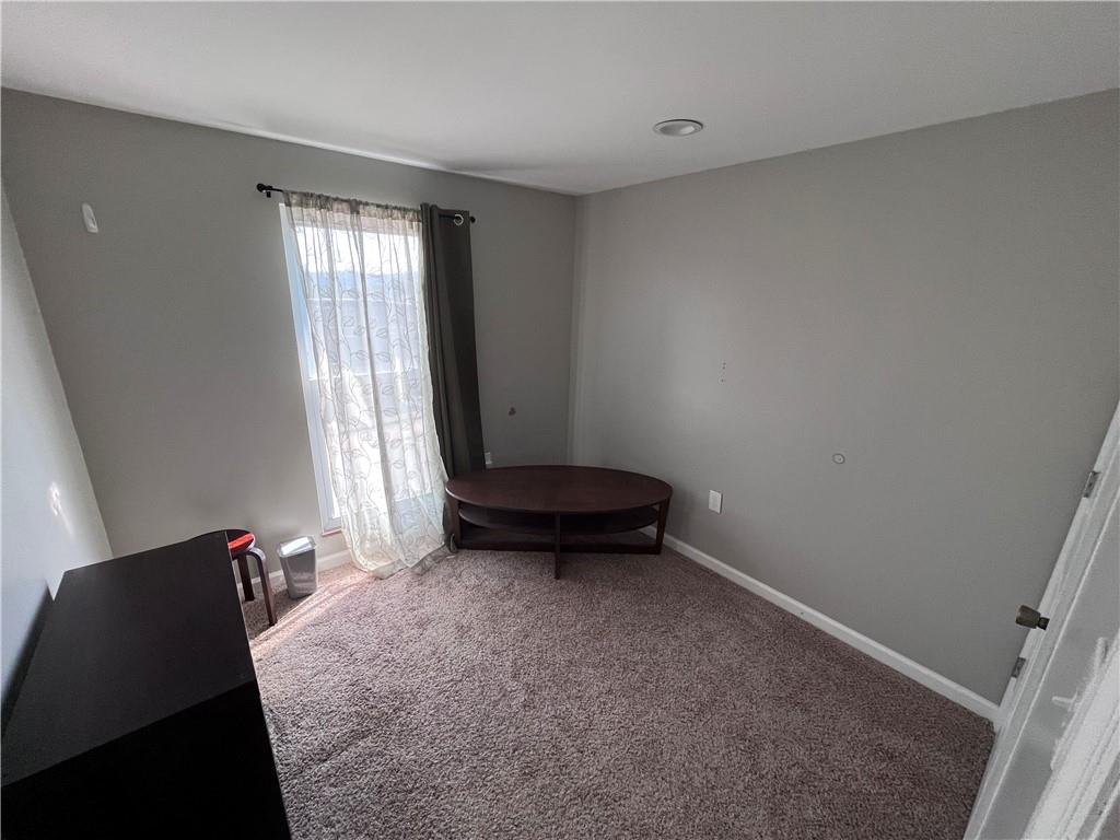 1875 Linton Street Pittsburgh, PA 15219 - Photo 21 of 24 a living room with a bed and a window