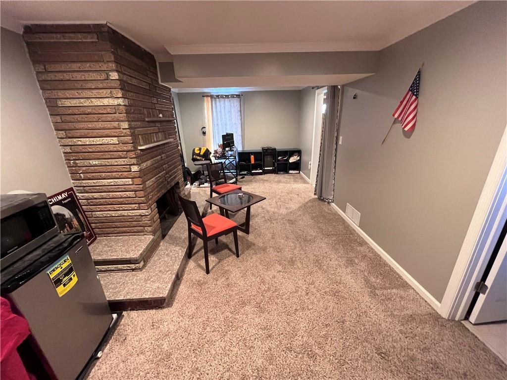 1875 Linton Street Pittsburgh, PA 15219 - Photo 6 of 24 a living room with furniture and a window