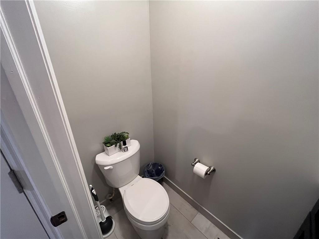1875 Linton Street Pittsburgh, PA 15219 - Photo 9 of 24 a white toilet sitting next to a shower