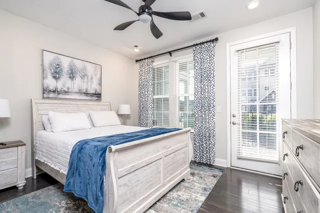 a bed room with a bed and a window