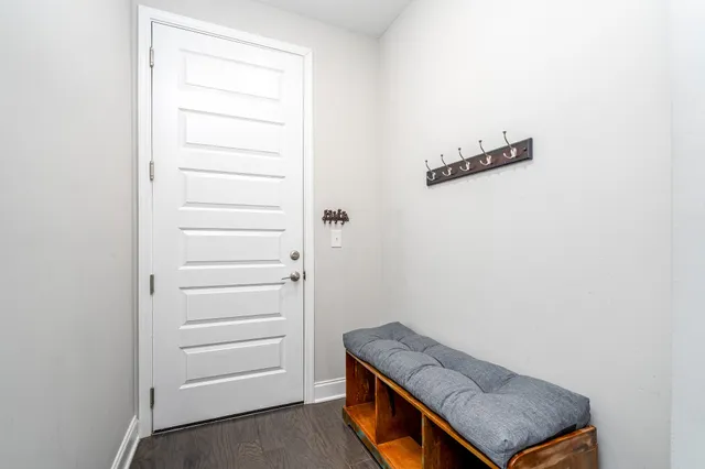 a balcony with couch and a gate