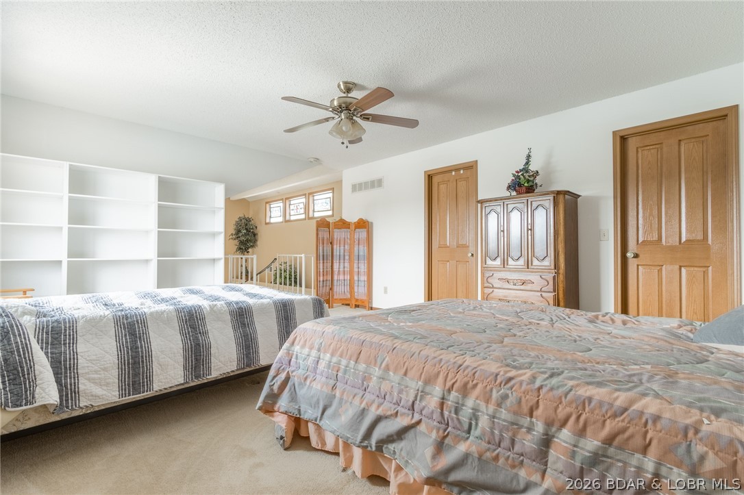 210 Bluff Boulevard, Unit 4B Camdenton, MO 65020 - Photo 23 of 69 Upper level lofted bedroom