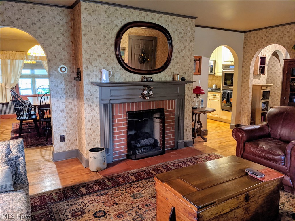 960 North Road Southeast Warren, OH 44484 - Photo 10 of 35 Living room flows into the dining room and kitchen. Working gas fireplace.