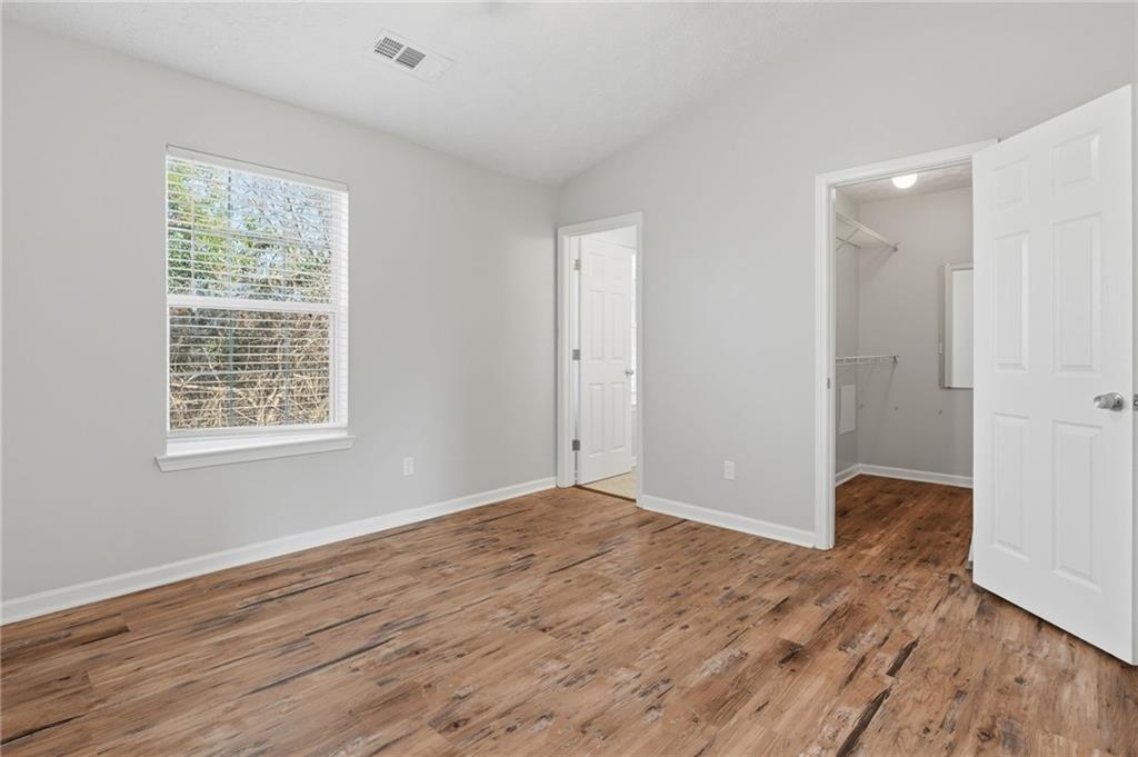 21 Timber Ridge Drive Cartersville, GA 30121 - Photo 16 of 24 a view of an empty room with wooden floor and a window
