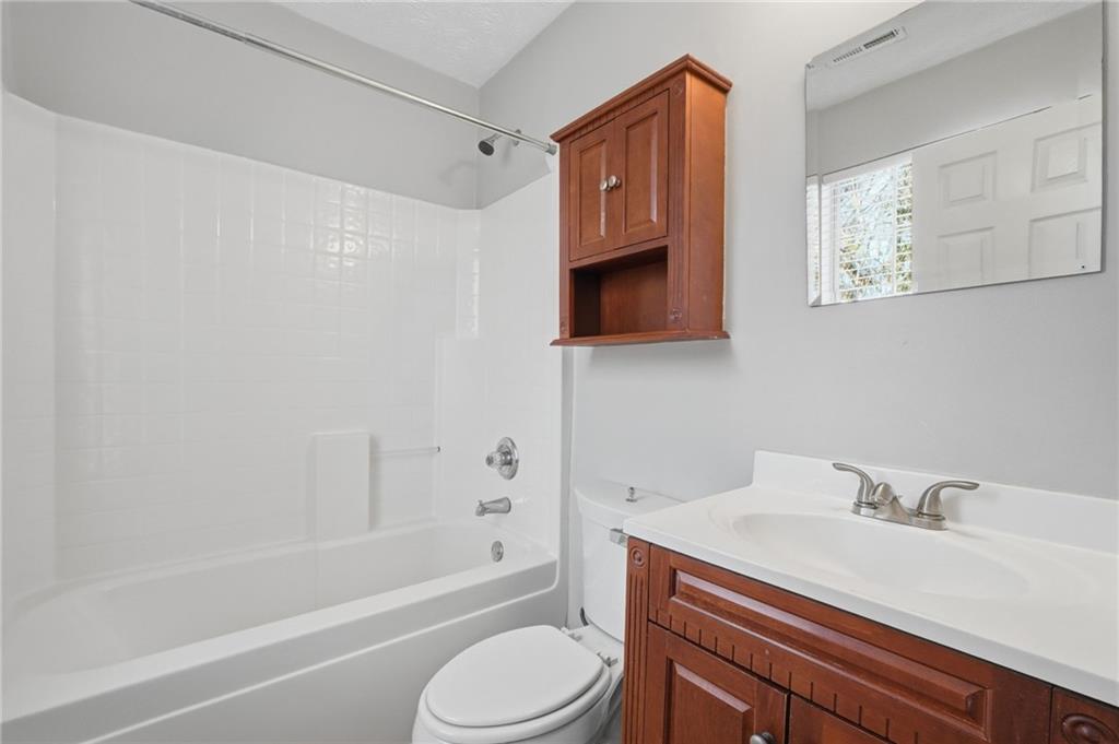 21 Timber Ridge Drive Cartersville, GA 30121 - Photo 17 of 24 a bathroom with a sink toilet a mirror and bathtub