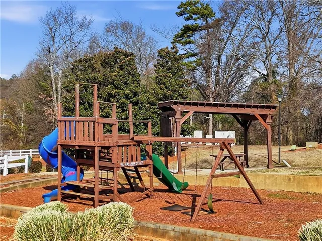 a view of a chairs and table on the patio