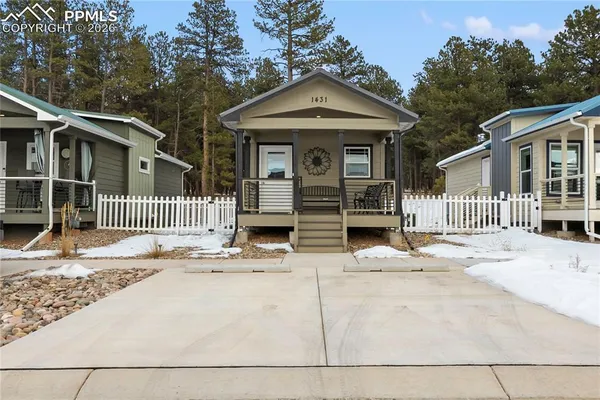 a front view of a house with a garage