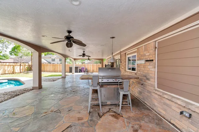a living room with a large window and a table