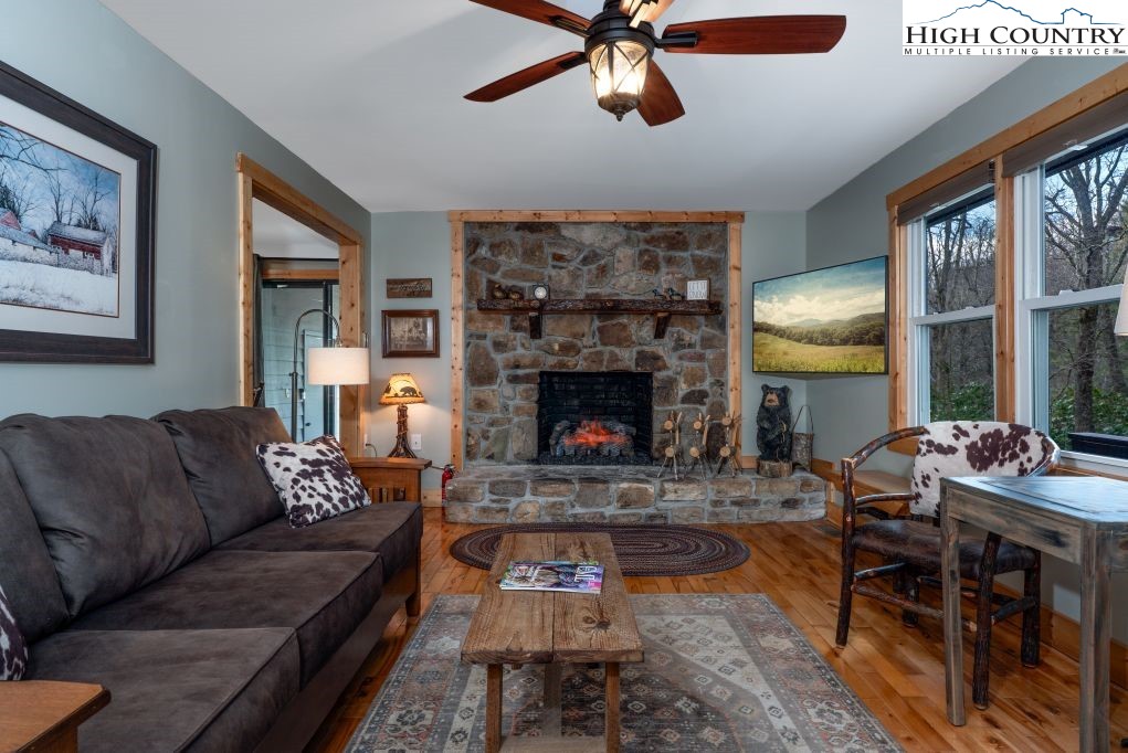 25 Red Oak Road Newland, NC 28657 - Photo 21 of 45 a living room with furniture and a fireplace